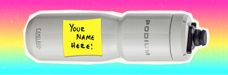 A podium steel bottle sitting horizonal with a sticky note on it which reads "Your Name Here!"